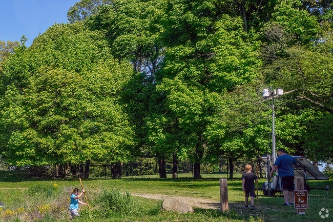 A family goes on a nature hike in Bancroft Park, a large park located in Northtown.