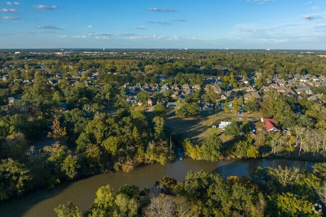 The Vermilion River winds through Acadiana Wood neighborhood.