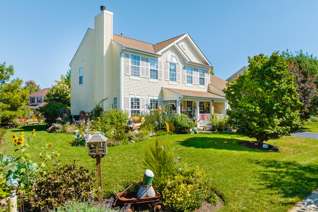 Colonial homes with lively landscaping can be found throughout Heron Harbor.