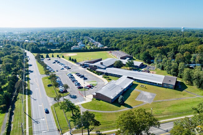 Mills Pond Elementary lies at the busy intersection of Moriches Rd and Woodlawn Ave.