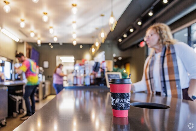 Park Plaza residents grab a cup of coffee at Crazy Llama Coffee.
