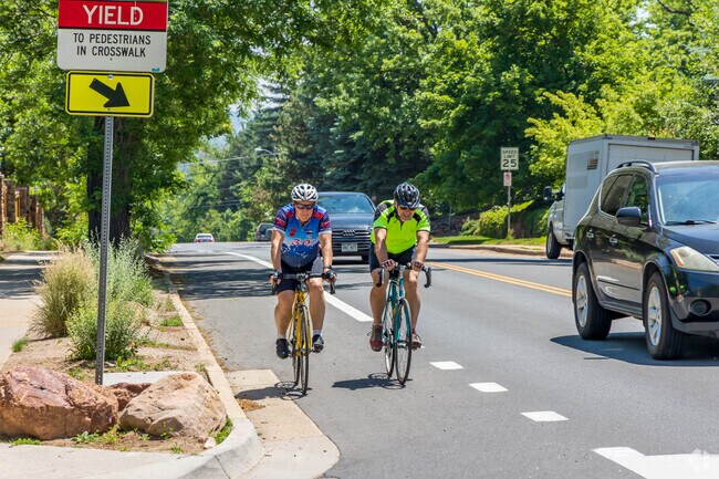 Locals use the wide bike lanes on Baseline Road to commute down into Boulder.