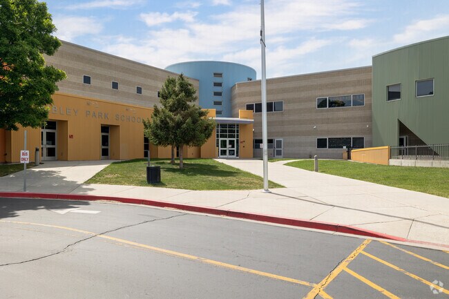 Nibley Park School wows with its combination of square and round forms and muted tones of yellow, green and blue in Millcreek.