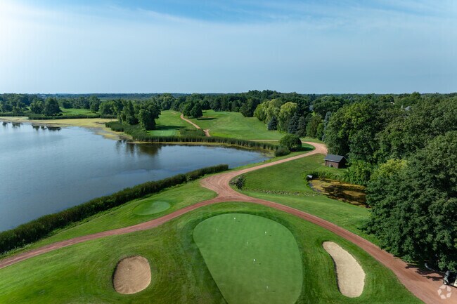 Golfers tee off at Nippersink Golf Club, a scenic course in Bloomfield.