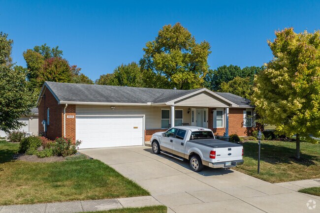Craftsmen homes in Forest Ridge Quail Hollow sit on sidewalk lined streets.