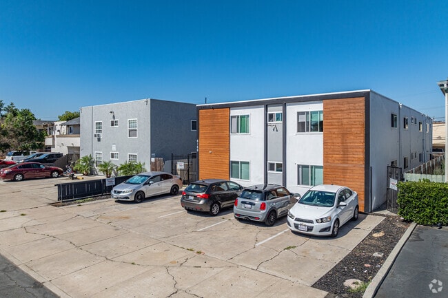 Refurbished condominiums and apartment complexes are interspersed between residential homes.