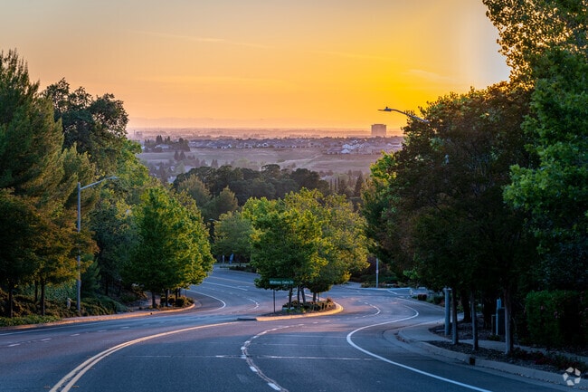 Beautiful sunset over clean streets of Whitney Oaks.