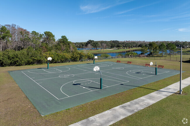 Children at Cypress Springs Elementary School delight in playing basketball.