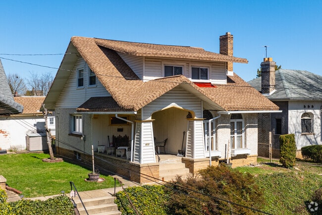 A charming Craftsman home with a small front porch in Fox Chase.