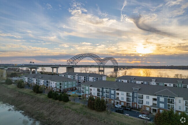 Mud Island Apartments offer stunning views of the Hernando De Soto Bridge at sunset.
