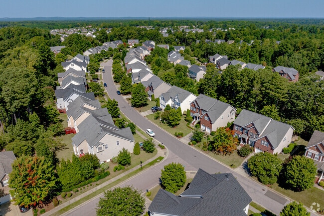 Houses are separated by large natural areas of green trees in Weldon Ridge.