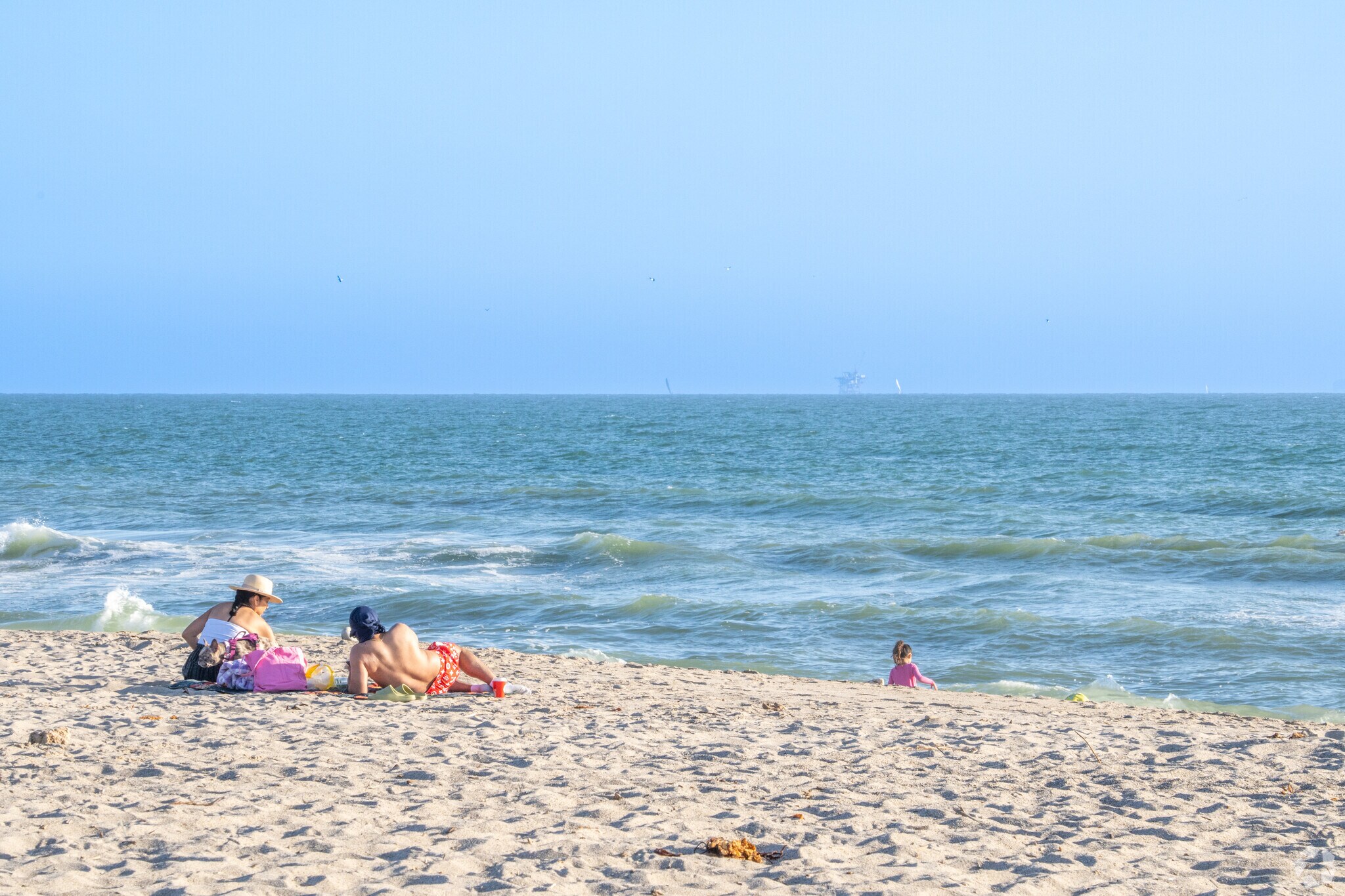 Locals drive 10 minutes to 'olołkoy Beach Park for a day at the beach.