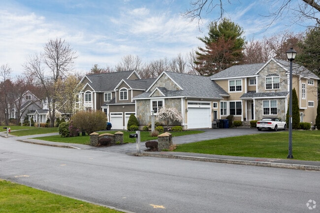 A row of homes showcasing the various architectural styles you will find in Dracut.