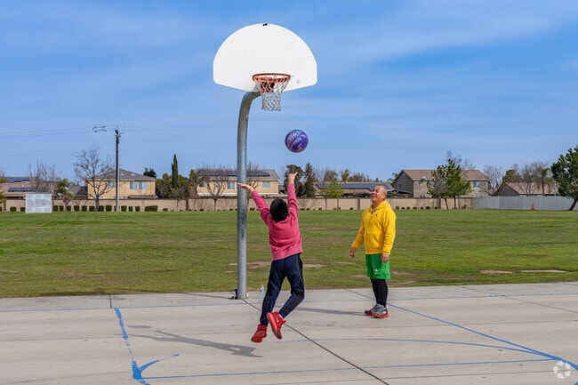 A young man practices his basketball skills at Polo Park near Nottingham Estates.