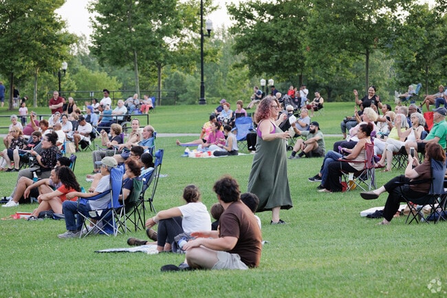 People dance to Mi Gente Live at Overpeck County Park's Music in the Park concert.
