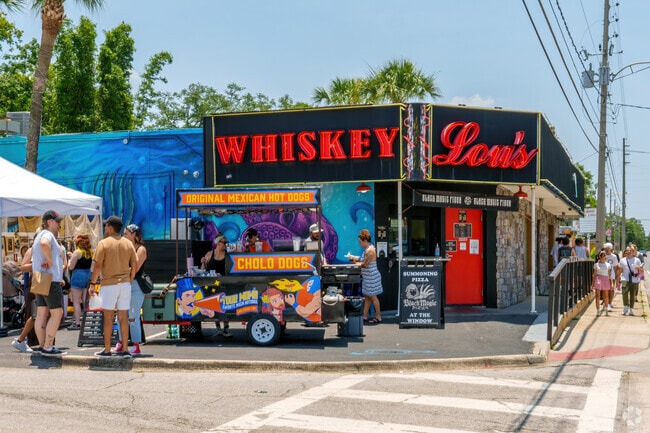 Nearby venues transform into a walkable market during Milk Mart, drawing crowds from across Orlando.