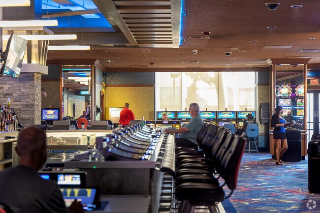 Bullhead City locals and tourists are seen at the nearby gambling machines.