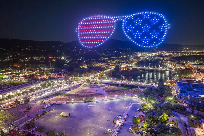 An American themed pair of glasses floats over McPherson at the Fourth of July Drone Show.