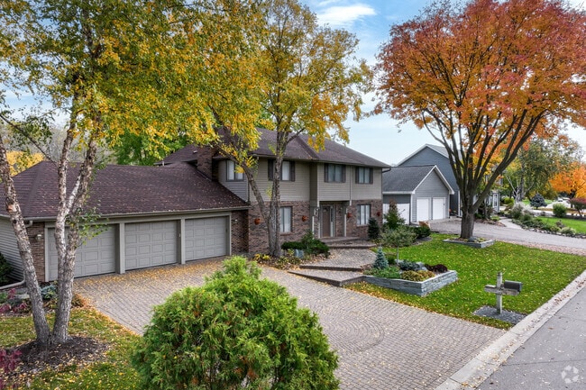 Many homes in the Dewey Hill neighborhood have lush landscaping.