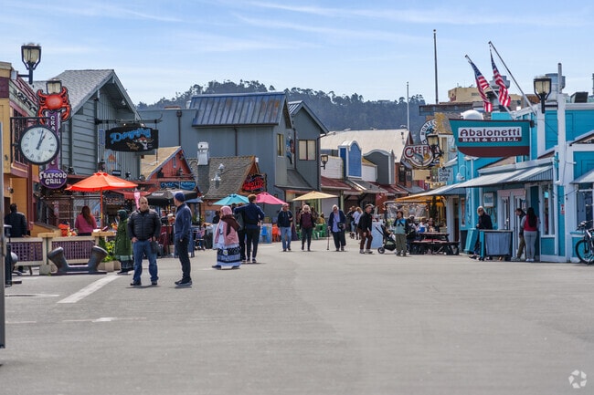 Bustling activity with tourists on Monterey Pier near Moss Landing.