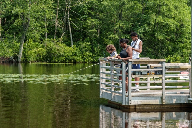 A group of young people cast their lines into Little Pine Lake at Diane P. Stinney Memorial Park.