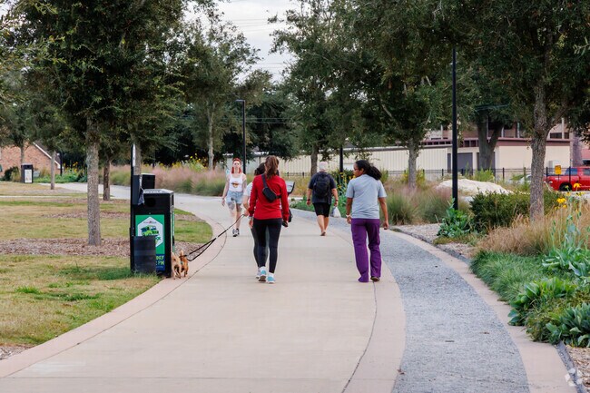 Residents of Greenbrier enjoying their afternoon walks in Moncus Park.