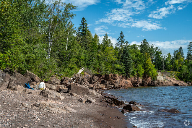 Congdon Park residents head to 42nd Ave E Park Beach for a calming day by the water.