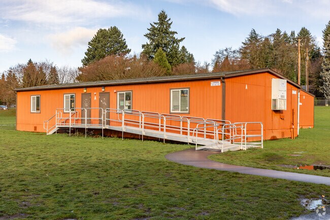A bright orange portable creates alternative learning spaces at Harney Elementary School