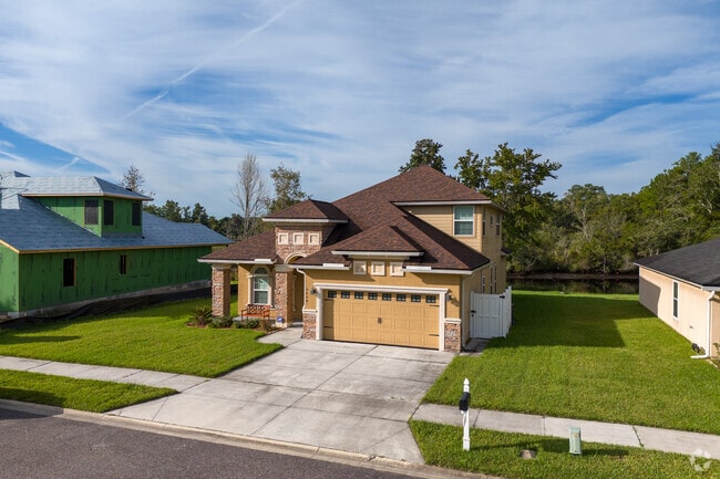 A typical two-story home with stone siding in Dinsmore.