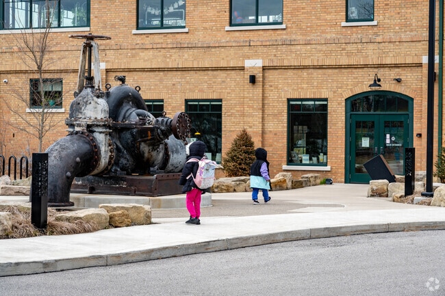 These children in Summit Lake explore the Summit Lake Nature Center.