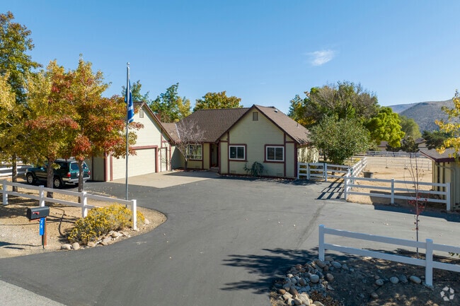 Homes in Pleasant Valley often have multiple structures including detached garages and sheds.