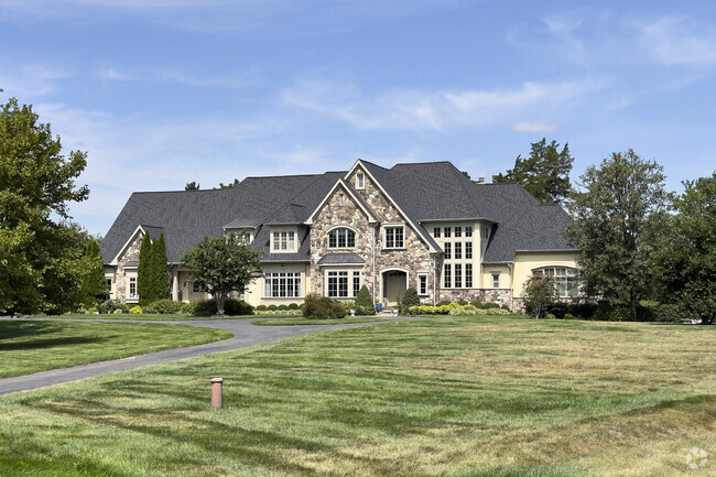 A large custom stone front home in Red Cedar.