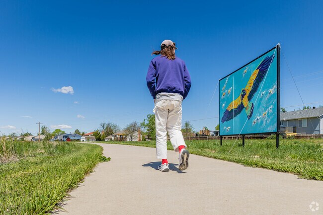 A network of walking trails in Bennett allows people to exercise beside colorful artwork.