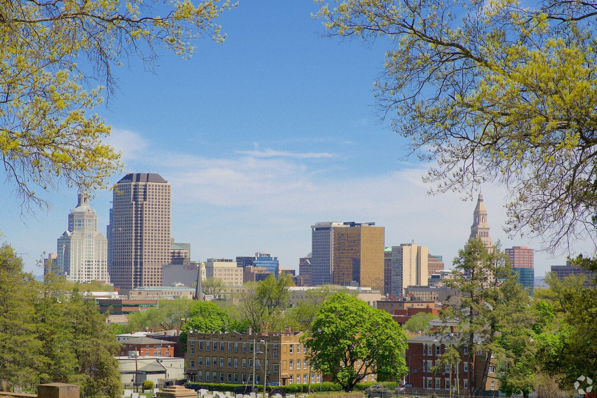The skyline of  Frog Hollow is a collection of towering buildings and residential homes.