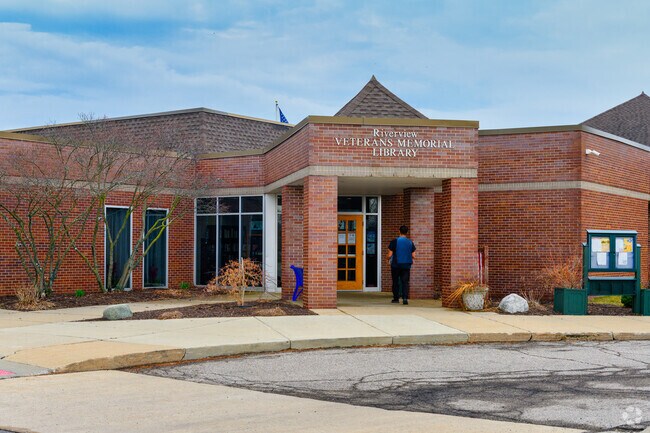 Riverview Public Library is located inside Young Patriots Park near the reflection pond.