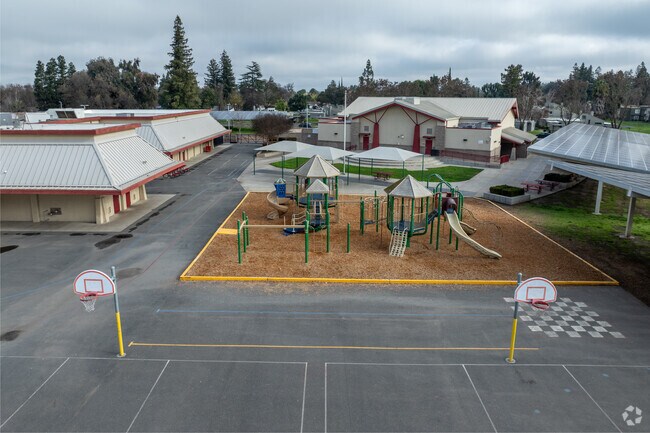 Discover laughter and learning at Mable Barron School's lively playground.