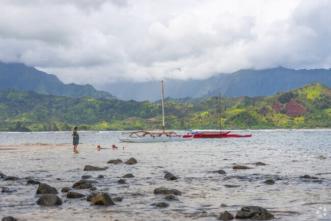 Visitors to Pu'u Poa Beach can enjoy a serene atmosphere with beautiful sunsets.