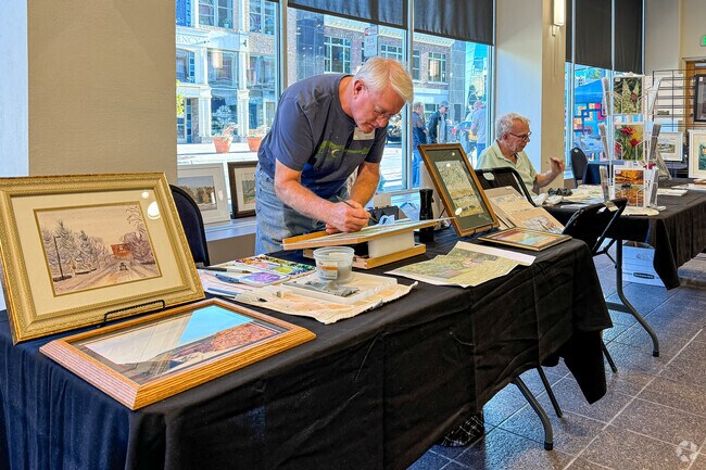 A painter demonstrates his water color technique at the St. Cloud Art Crawl near Wilson Park.