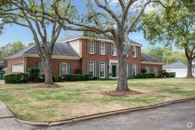 Blue shutters add charm to this colonial style home in Great McGehee Estates.