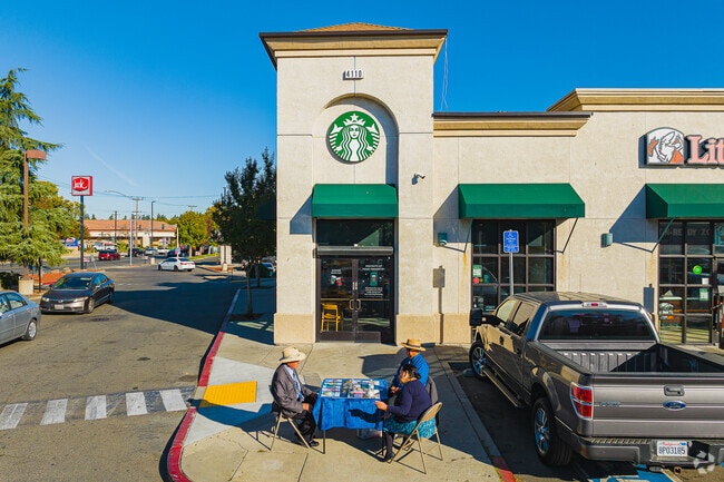 Locals set up a conversation booth in front of a Starbucks in Robla, Sacramento.