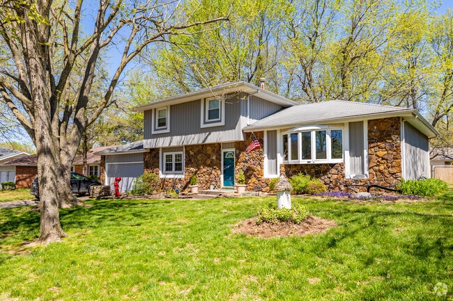 A 2-story home with a partial rock facade is well maintained in the Bradford Park neighborhood.