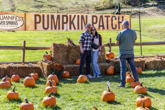 Couples enjoy a beautiful day at Autumnfest.
