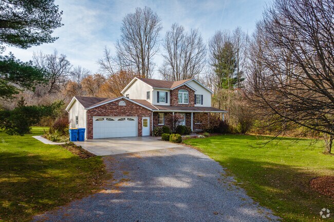 Many Wales homes sit back from the road with long driveways and trees.