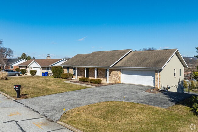 Ranch-style homes in North York often include yards and porches.
