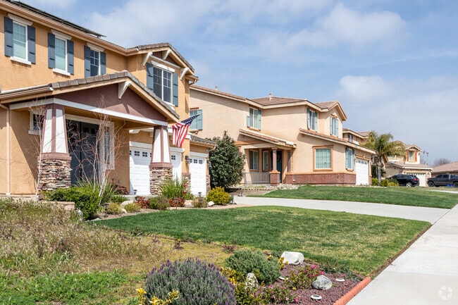 Nicely landscaped multi-story homes sit in Coyote Canyon, Fontana.