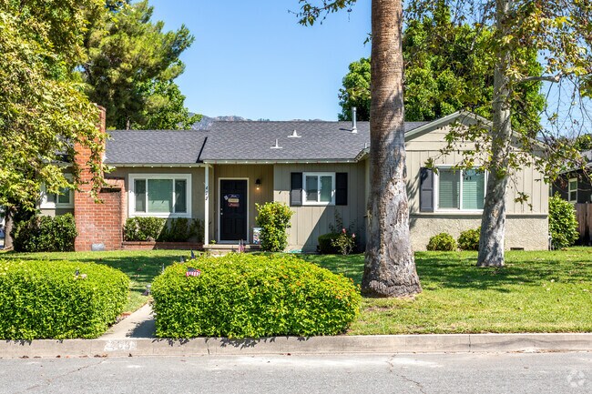 A beautiful ranch home nestled among trees in The Village.