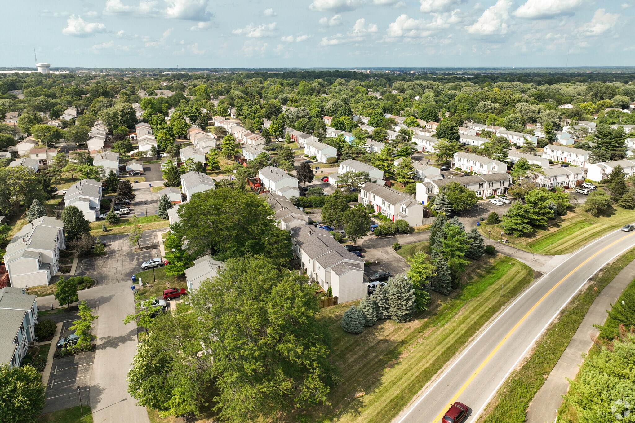 Mature trees line the suburban streets of Worthington Village North.