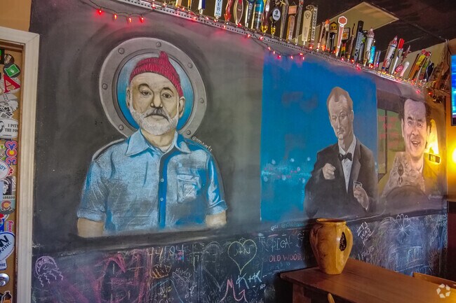 Paintings of Bill Murray on the wall of  the Growler Run Beer store in the Gaffney Neighborhood.