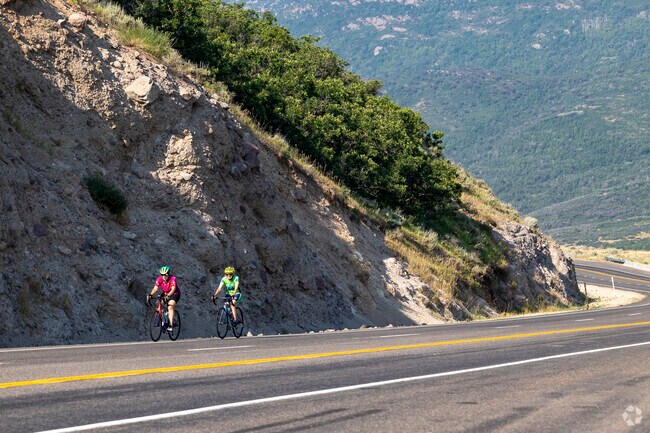 Friends make the grueling ride up State Road 32 heading towards Kamas Valley.