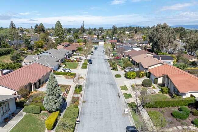 Manicured lawns and peaceful streets make Almaden Meadows a desirable neighborhood.